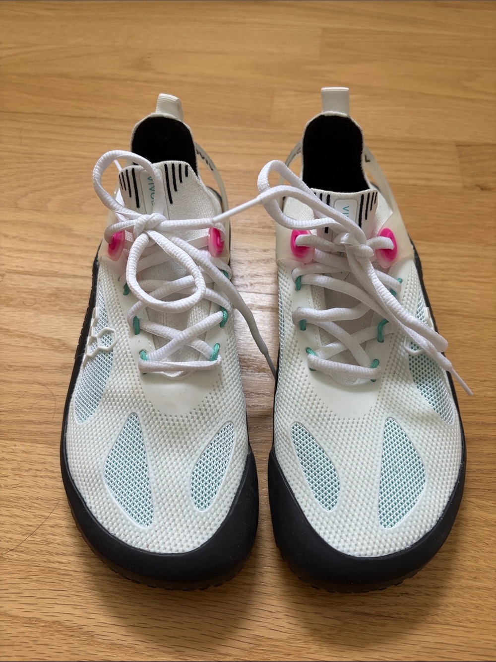 Vivo Barefoot White Athletic Shoes with Black Soles and Pink Accents